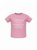 Pink t-shirt with text 'Daddy Knows a lot but Grandpa Knows everything' on a white background
