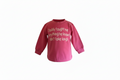 Pink long-sleeve shirt with text on a white background