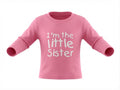 Pink long-sleeve shirt with 'I'm the little sister' text on a white background