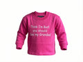 Pink children's sweatshirt with text on a white background